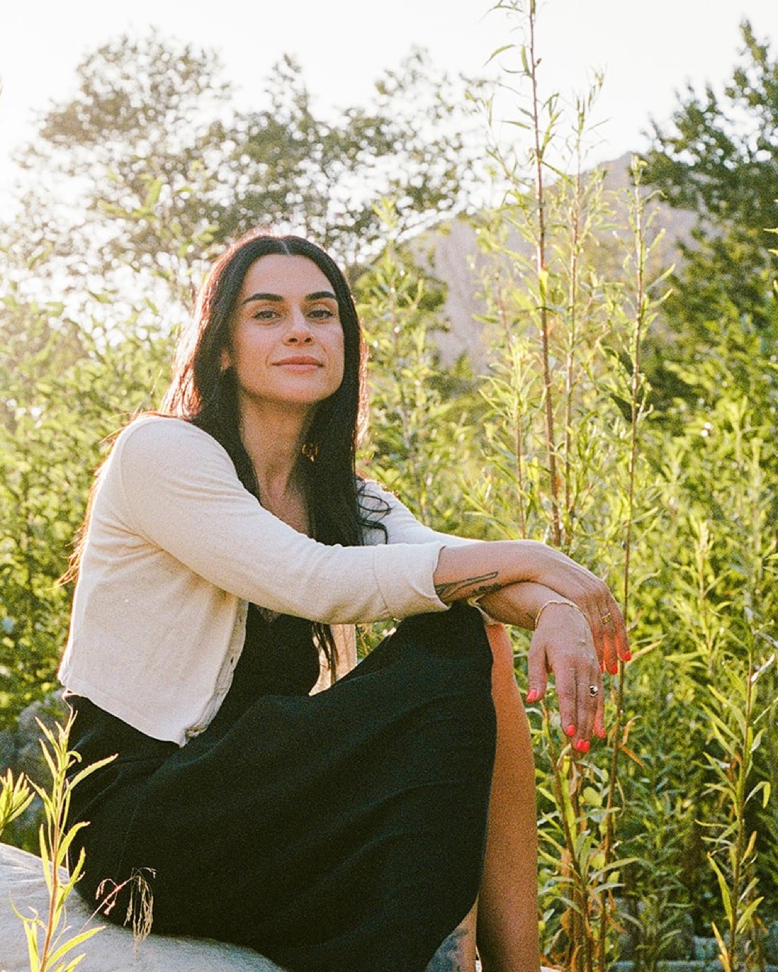 Mariam Friedman, sitting under a willow in Ojai, California